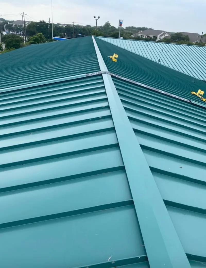 Green commercial metal roof ridge and valley for Metal Roof Repair in Pike Creek