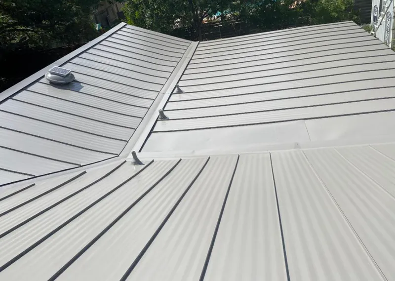 Solar attic fan installed on a metal roof for Roof Ventilation in Pike Creek
